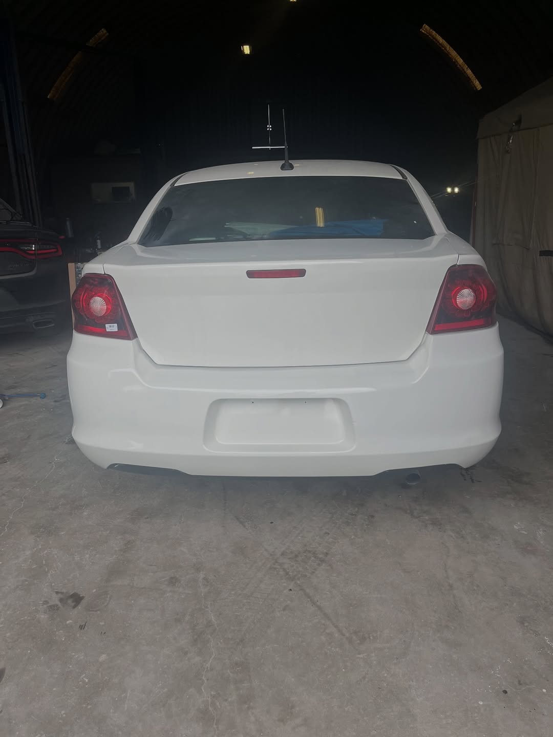 Dodge Avenger after repair — rear end fully restored with factory paint match